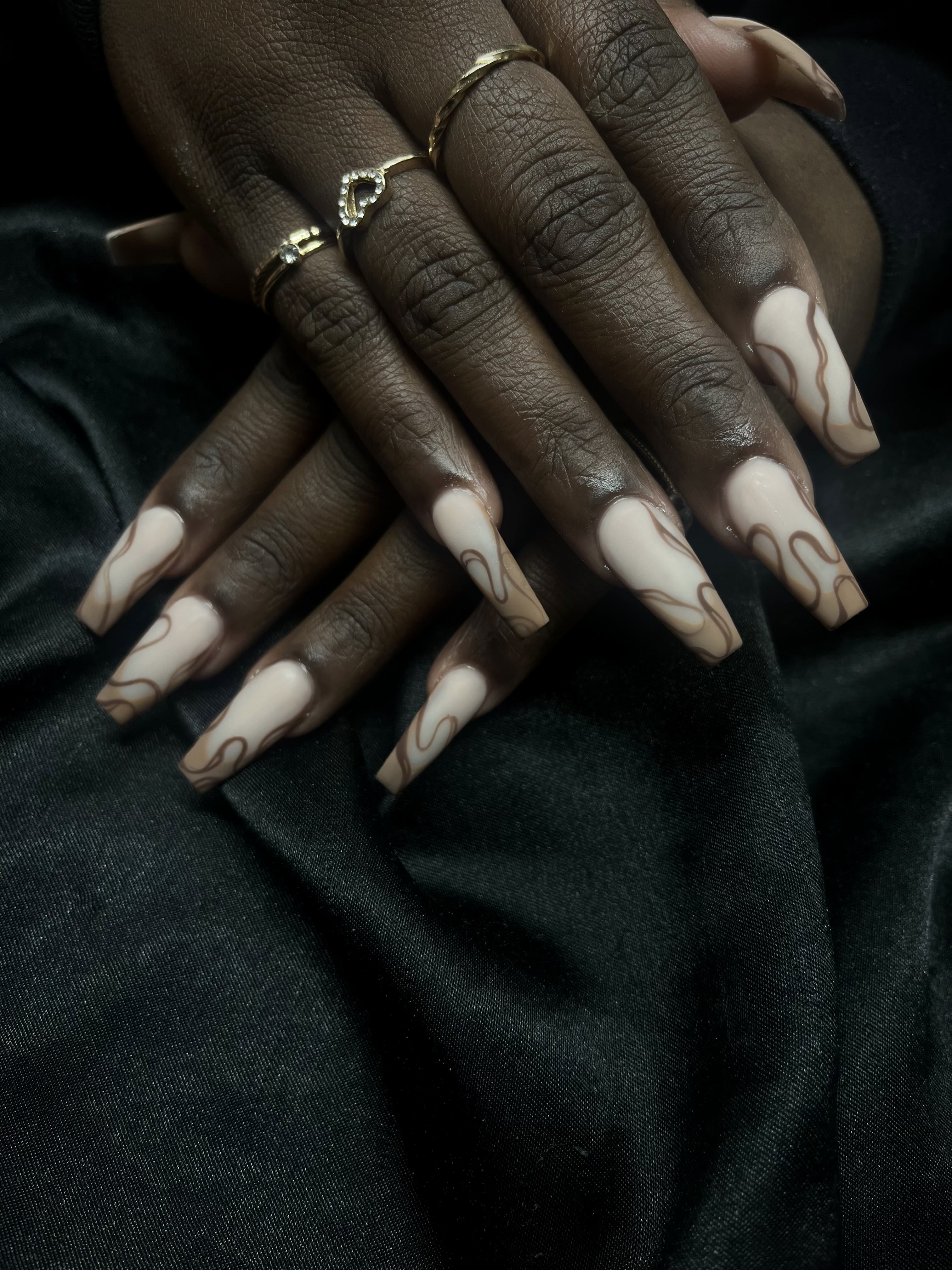 Cream coffin nails with brown swirl art on velvet