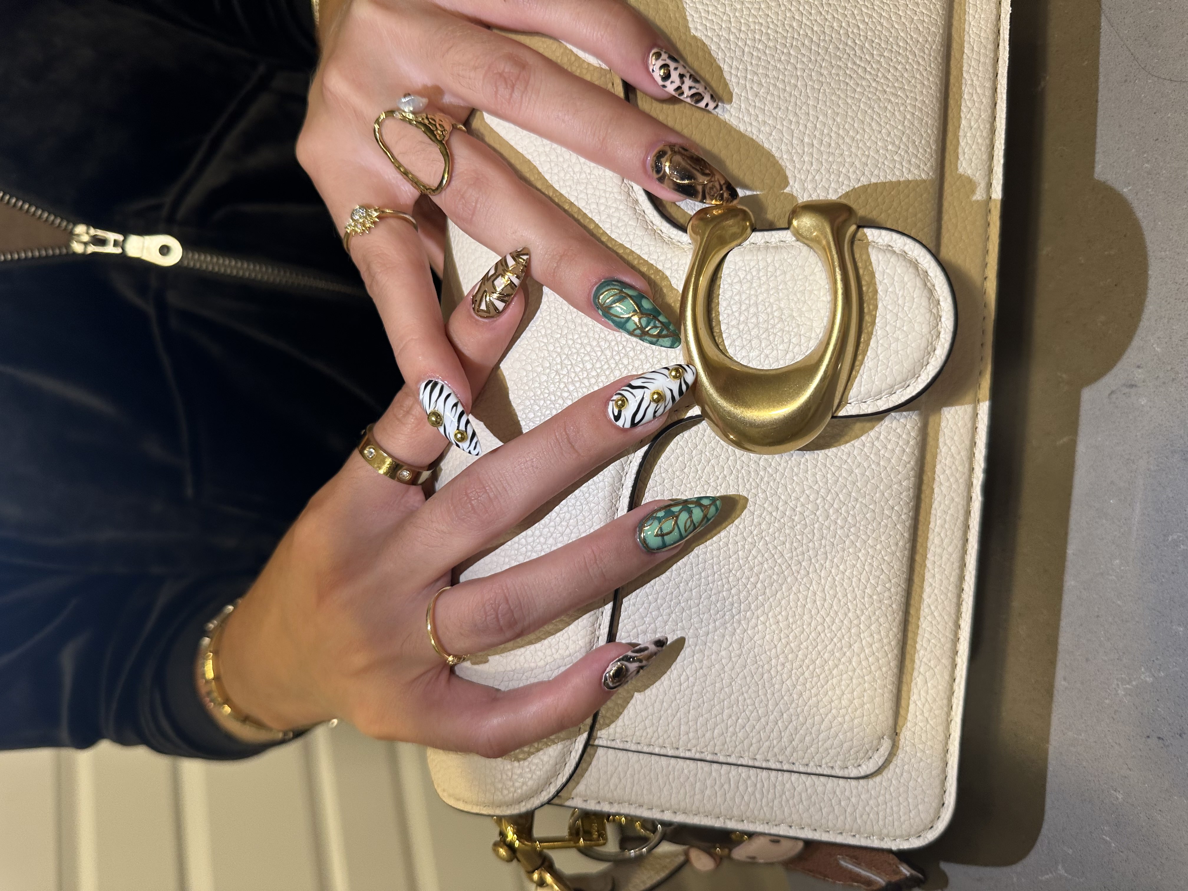 Wild animal print nail art on stiletto — luxury editorial look