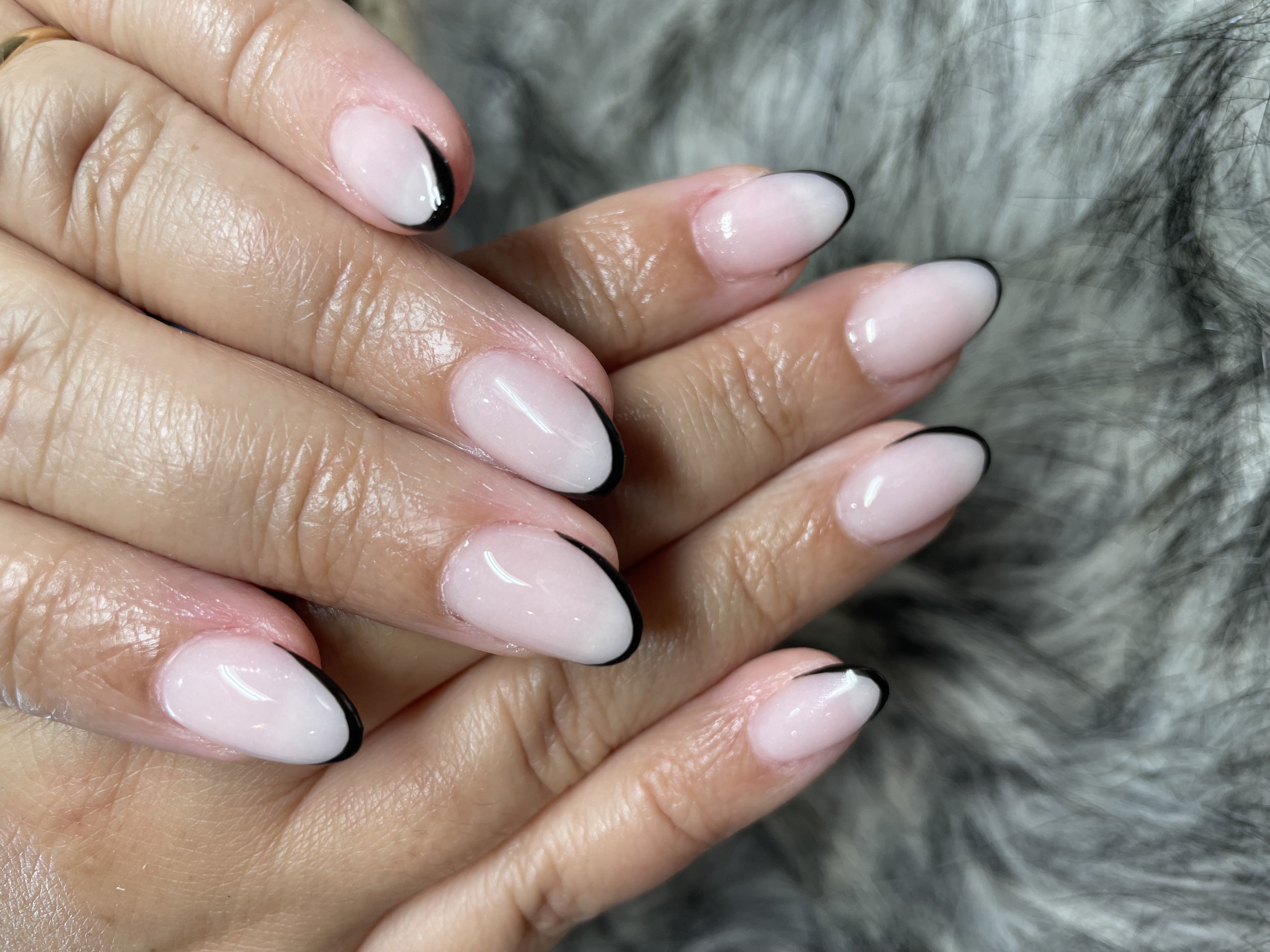 Classic black French tip nails — clean and sophisticated