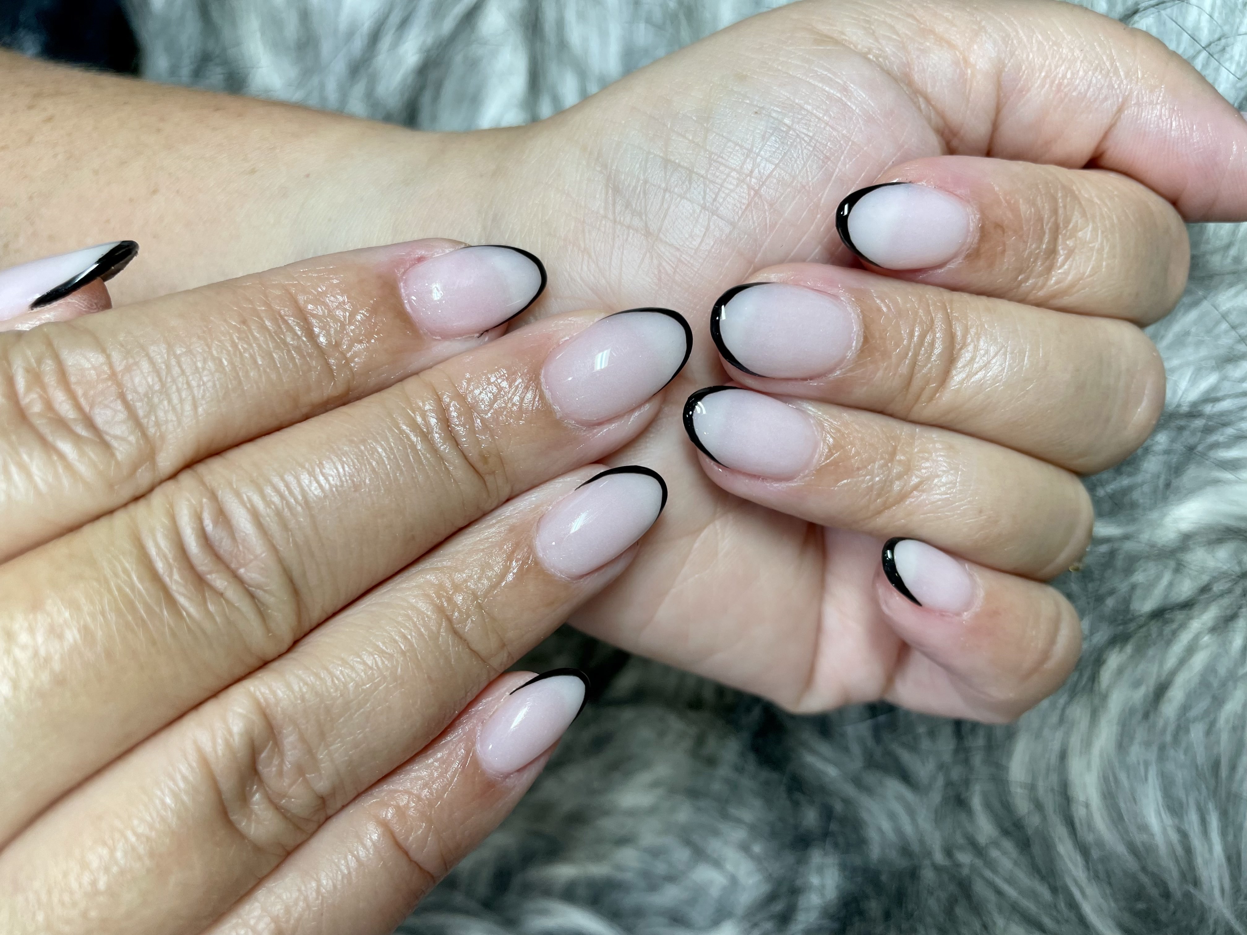 Black French almond nails — sleek modern French tip