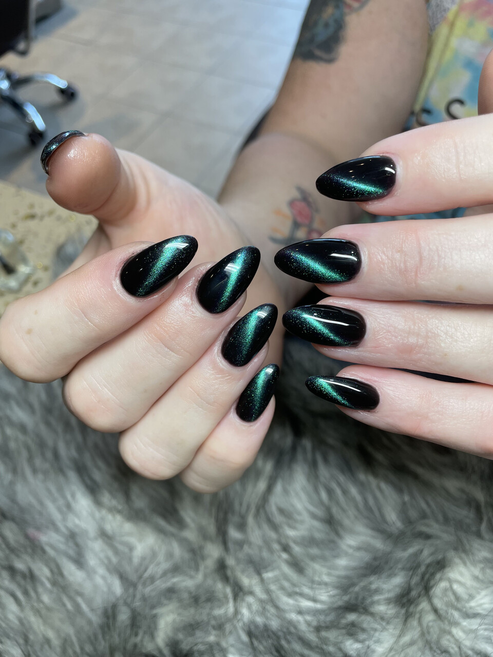 Black cat-eye chrome nails — dramatic and bold