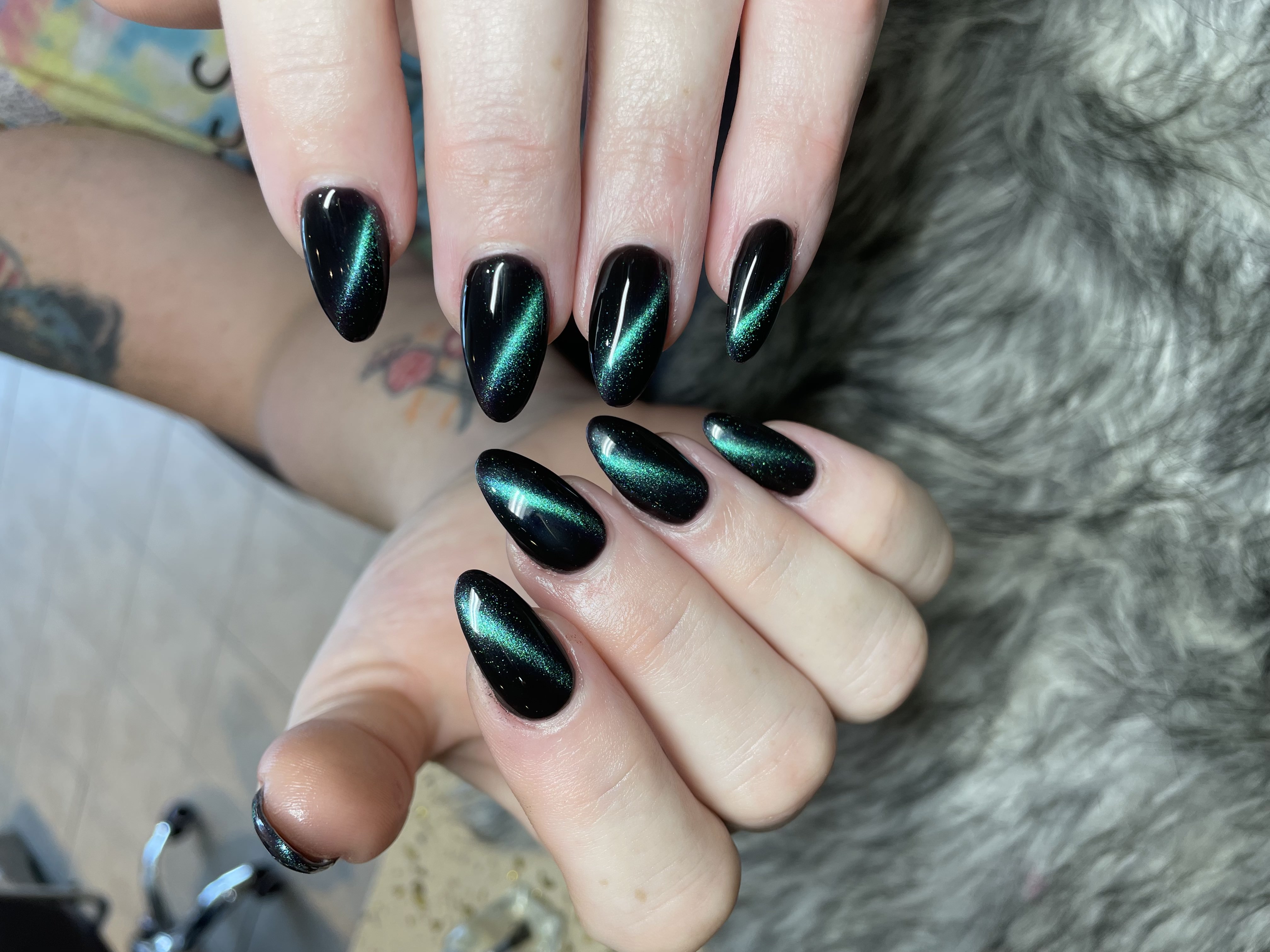 Black cat-eye chrome nails — dramatic and bold