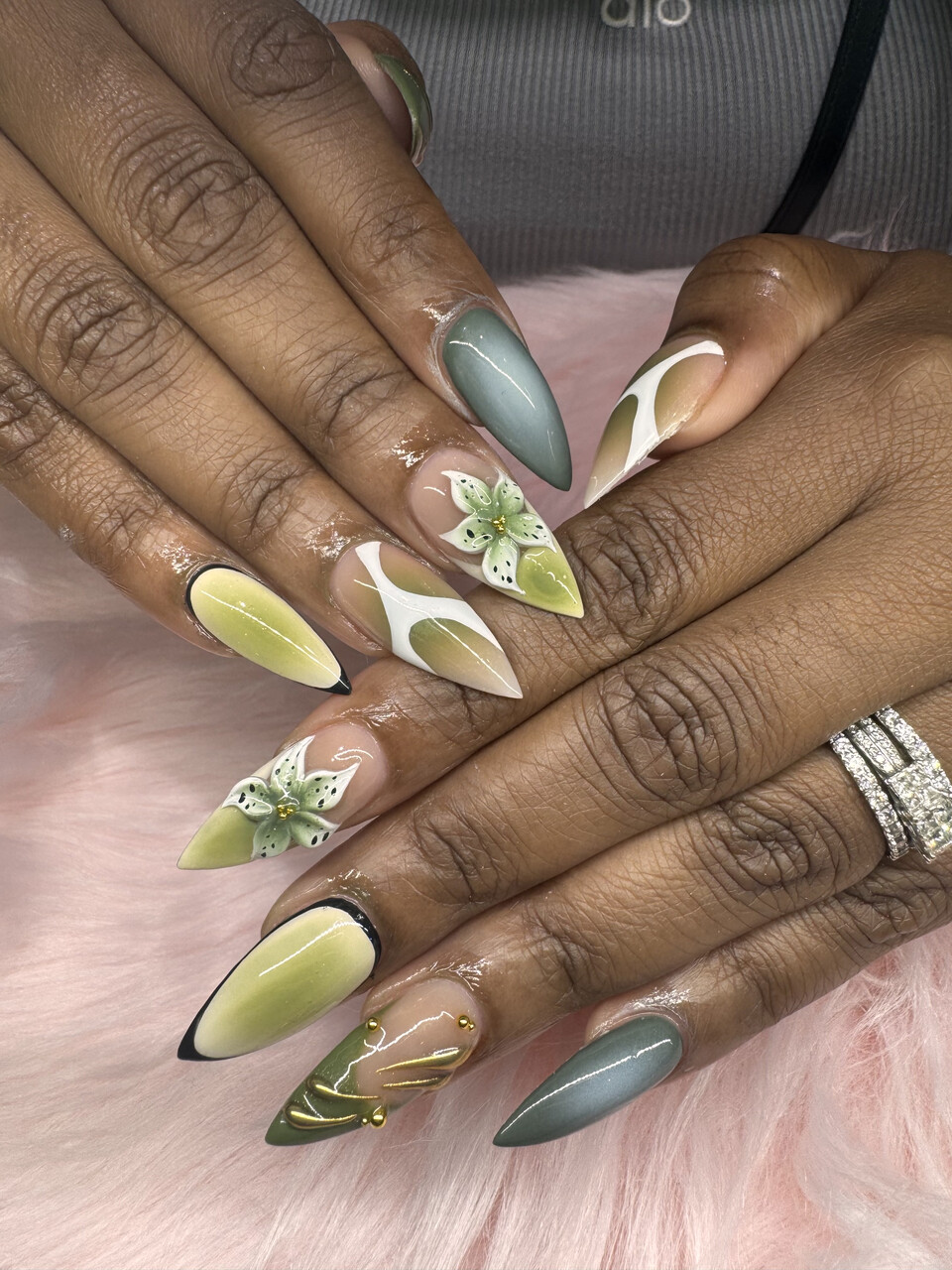 Sage green floral nail art — detailed and delicate