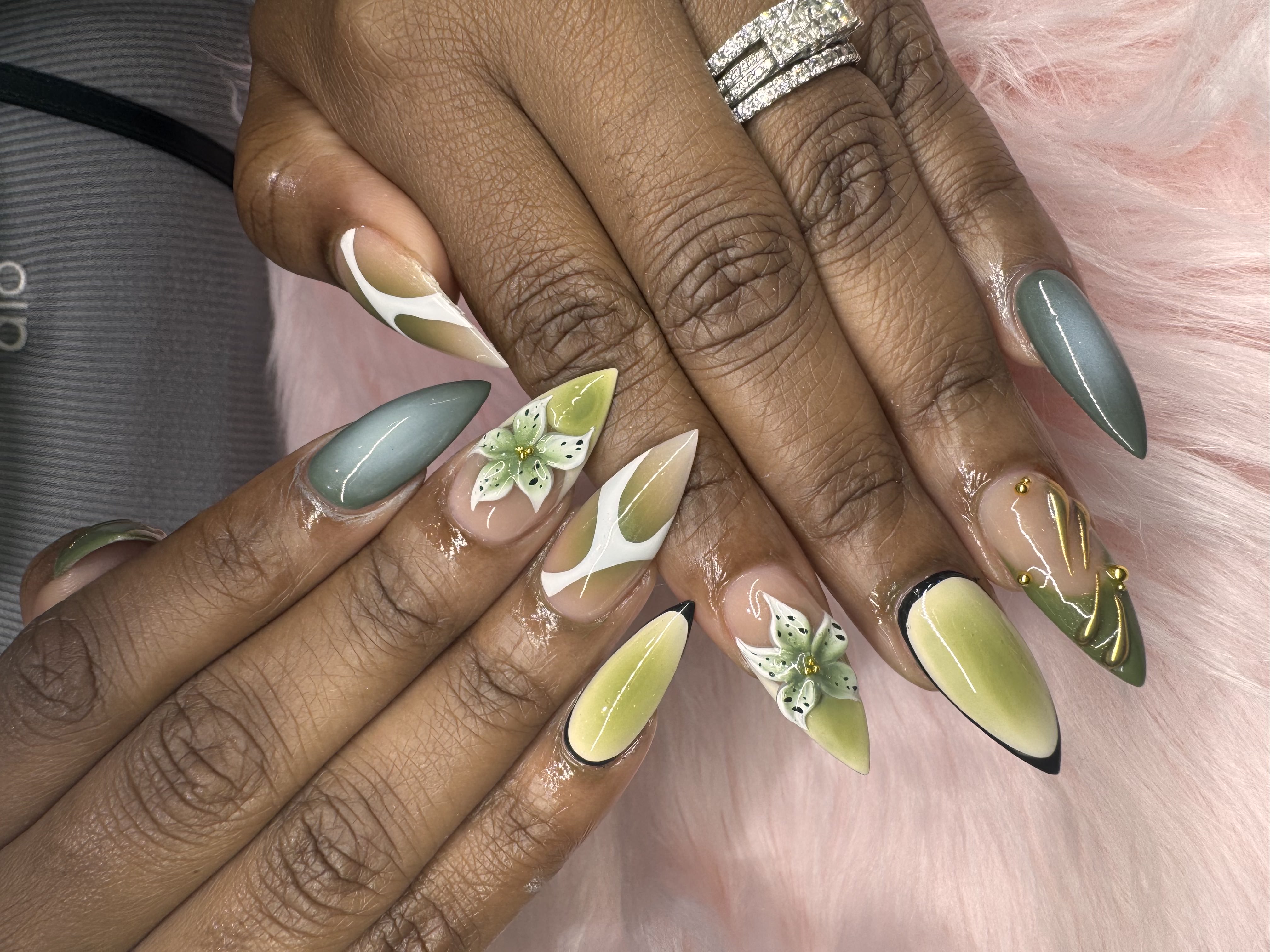 Sage green floral nail art — detailed and delicate
