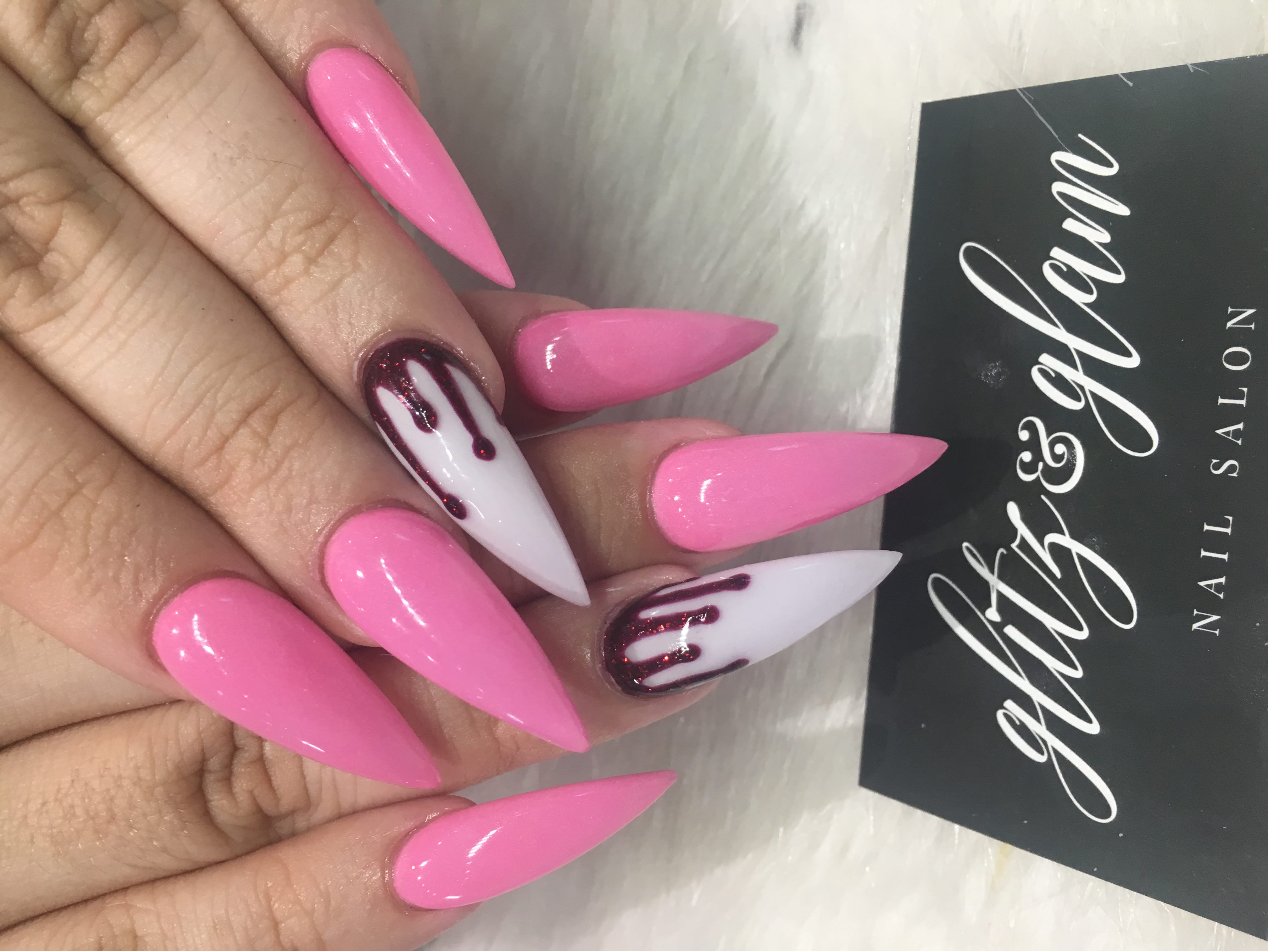 Pink stiletto nails with drip art — Glitz & Glam logo card