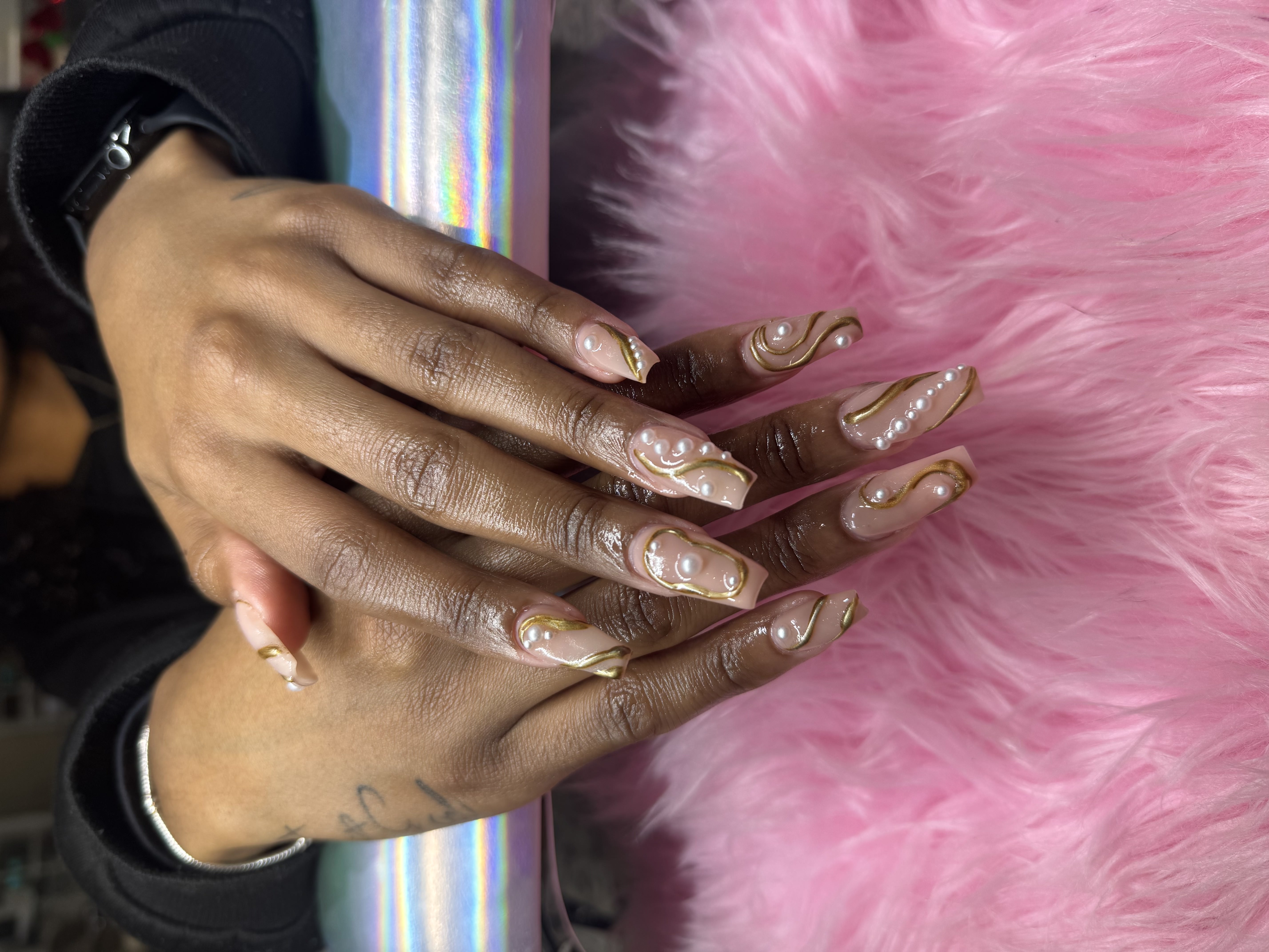 Nude coffin nails with gold swirls and pearl accents